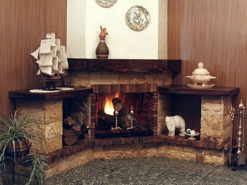 Угловые камины в интерьере гостиной – душевное тепло в доме